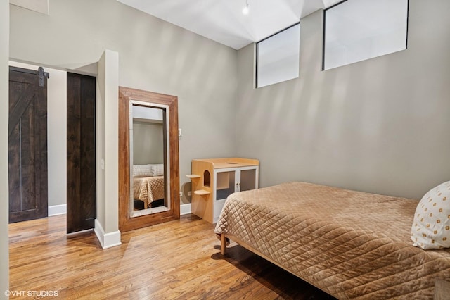 165 N Canal St Unit 1231, Chicago, IL 60606 - bedroom featuring light wood-type flooring and a towering ceiling