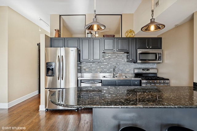165 N Canal St Unit 1231, Chicago, IL 60606 - kitchen with stainless steel appliances, tasteful backsplash, pendant lighting, dark wood-style floors, and dark stone countertops