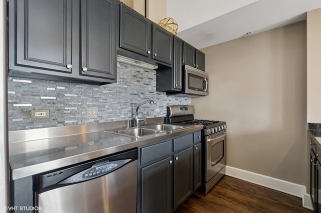 165 N Canal St Unit 1231, Chicago, IL 60606 - kitchen with appliances with stainless steel finishes, decorative backsplash, dark wood-type flooring, and stainless steel counters