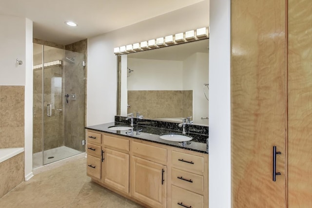 2310 S Canal St Unit 401, Chicago, IL 60616 - full bath featuring a stall shower, a garden tub, double vanity, tile patterned floors, and recessed lighting