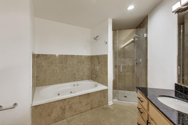 2310 S Canal St Unit 401, Chicago, IL 60616 - bathroom featuring vanity, a whirlpool tub, a stall shower, tile patterned flooring, and recessed lighting