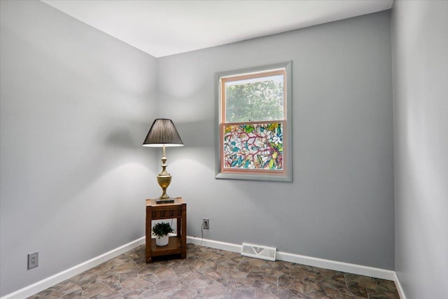 1209 Gettysburg Dr, Bloomington, IL 61704 - sitting room with baseboards and stone finish floors