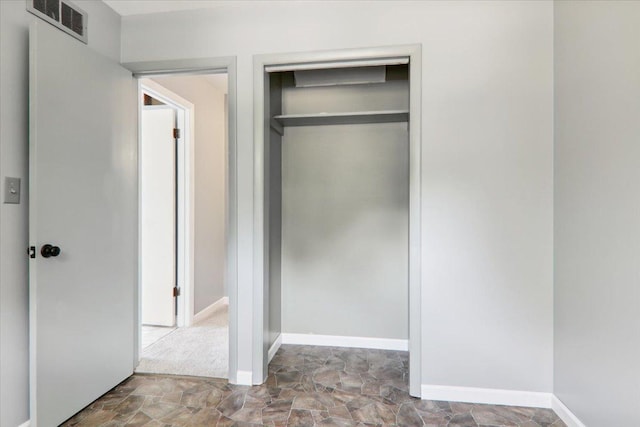 1209 Gettysburg Dr, Bloomington, IL 61704 - unfurnished bedroom featuring a closet and stone finish flooring