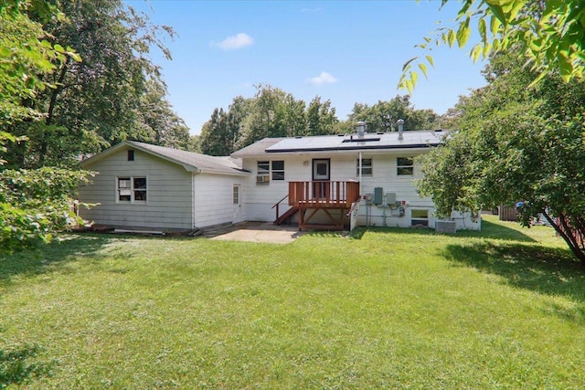 1209 Gettysburg Dr, Bloomington, IL 61704 - rear view of property with a deck, a lawn, a patio, and solar panels