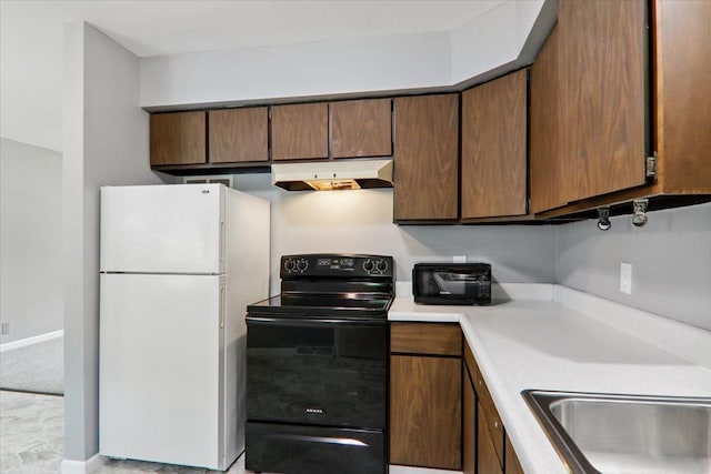 1209 Gettysburg Dr, Bloomington, IL 61704 - kitchen with freestanding refrigerator, electric range, under cabinet range hood, and light countertops