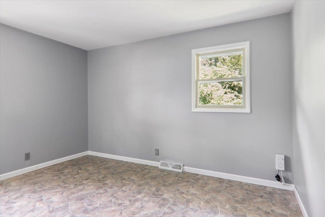 1209 Gettysburg Dr, Bloomington, IL 61704 - unfurnished room featuring stone finish flooring