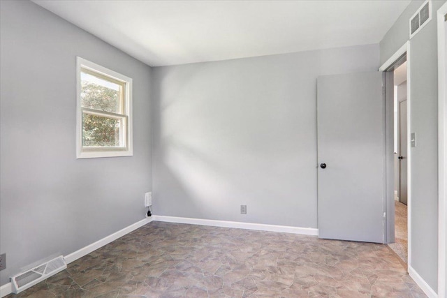1209 Gettysburg Dr, Bloomington, IL 61704 - unfurnished room with baseboards and stone finish flooring