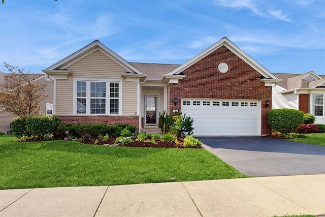 3201 Rockwell Cir, Mundelein, IL 60060 - view of front of house with brick siding, driveway, a front yard, and an attached garage