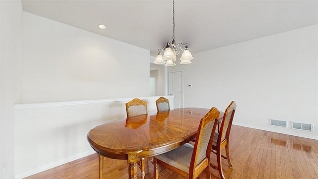 3201 Rockwell Cir, Mundelein, IL 60060 - dining space featuring a chandelier and light wood-type flooring