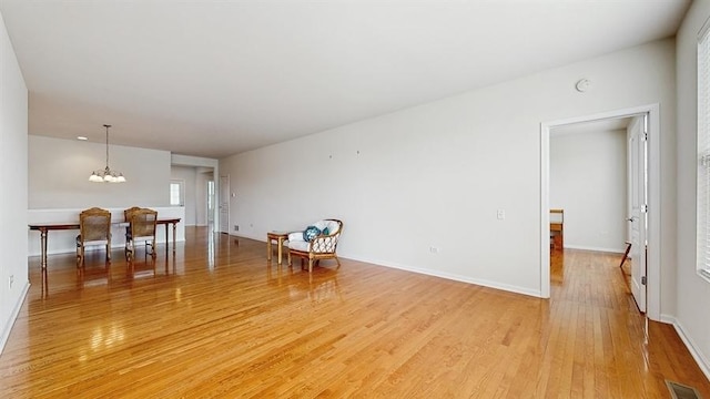 3201 Rockwell Cir, Mundelein, IL 60060 - living area featuring light wood-style floors and a chandelier