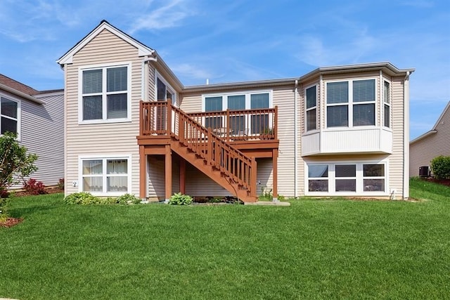 3201 Rockwell Cir, Mundelein, IL 60060 - back of property featuring stairway, a deck, and a yard