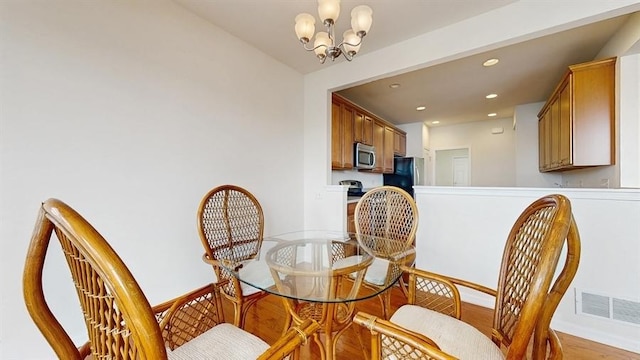 3201 Rockwell Cir, Mundelein, IL 60060 - dining area with a chandelier, recessed lighting, and wood finished floors