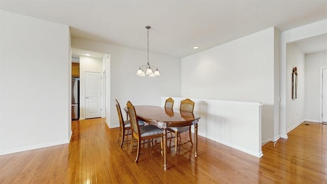 3201 Rockwell Cir, Mundelein, IL 60060 - dining space with light wood-style floors, a chandelier, and recessed lighting