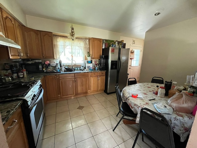 2 Mildred Ave, Glen Ellyn, IL 60137 - kitchen featuring appliances with stainless steel finishes, brown cabinetry, a sink, light tile patterned floors, and under cabinet range hood