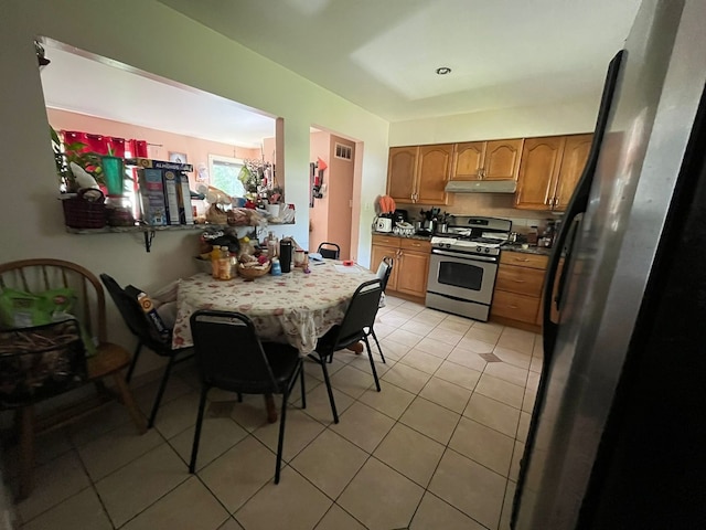 2 Mildred Ave, Glen Ellyn, IL 60137 - kitchen featuring gas range, under cabinet range hood, brown cabinetry, and light tile patterned flooring