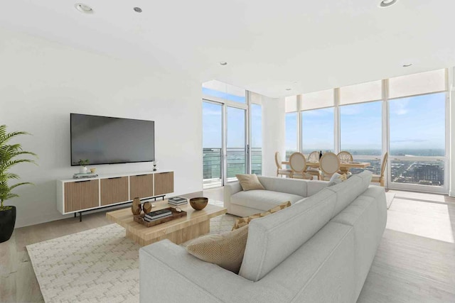 737 W Washington Blvd Unit 3308, Chicago, IL 60661 - living room featuring light wood-style floors, a wall of windows, and recessed lighting