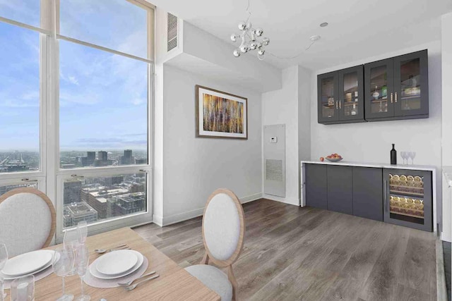 737 W Washington Blvd Unit 3308, Chicago, IL 60661 - dining space with a chandelier, wood finished floors, and a dry bar