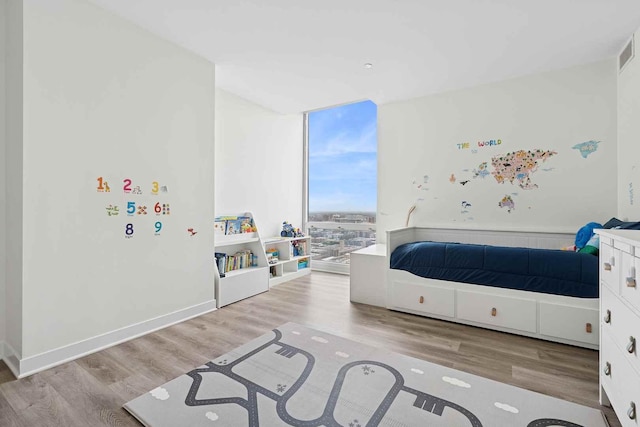 737 W Washington Blvd Unit 3308, Chicago, IL 60661 - bedroom featuring wood finished floors and floor to ceiling windows