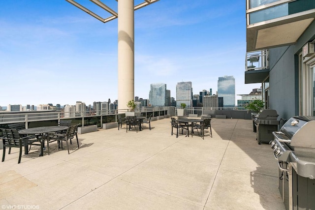 737 W Washington Blvd Unit 3308, Chicago, IL 60661 - view of patio / terrace featuring outdoor dining area, a view of skyline, and grilling area