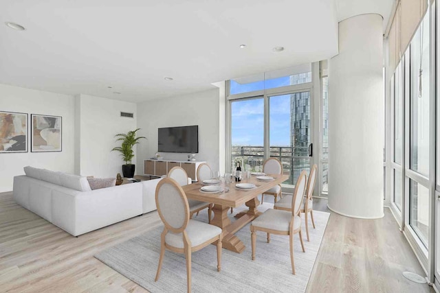 737 W Washington Blvd Unit 3308, Chicago, IL 60661 - dining space with light wood-style floors, a wall of windows, and recessed lighting