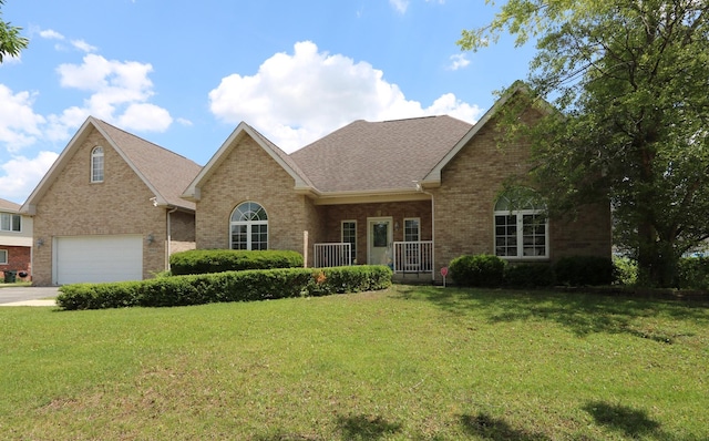 1053 Sycamore St, Beecher, IL 60401 - view of front of house with brick siding, a front lawn, a shingled roof, and driveway