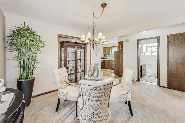 11531 S S Ave J, Chicago, IL 60617 - dining space with a chandelier, light colored carpet, and baseboards