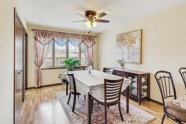 11531 S S Ave J, Chicago, IL 60617 - dining space featuring light wood-type flooring, a ceiling fan, and baseboards