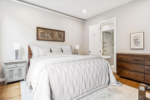 874 N Marshfield Ave Unit 1, Chicago, IL 60622 - bedroom featuring recessed lighting, wood finished floors, and connected bathroom