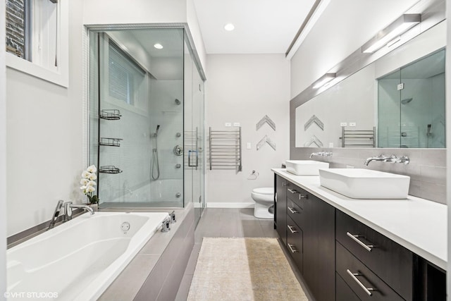 874 N Marshfield Ave Unit 1, Chicago, IL 60622 - full bathroom with a stall shower, double vanity, a bath, recessed lighting, and tile patterned floors