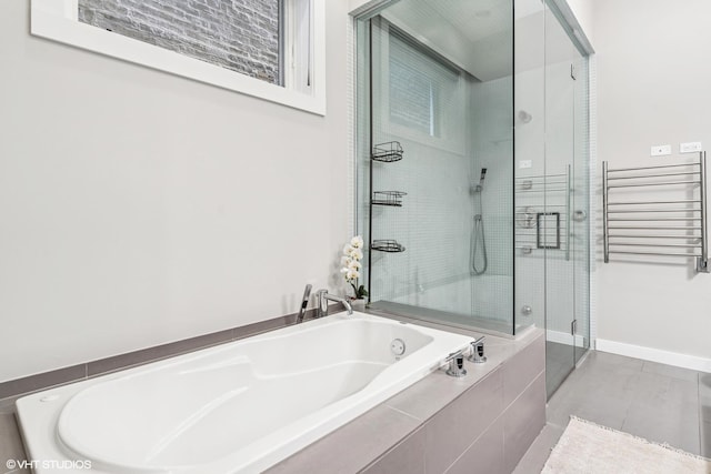 874 N Marshfield Ave Unit 1, Chicago, IL 60622 - bathroom with radiator, a bath, and a stall shower