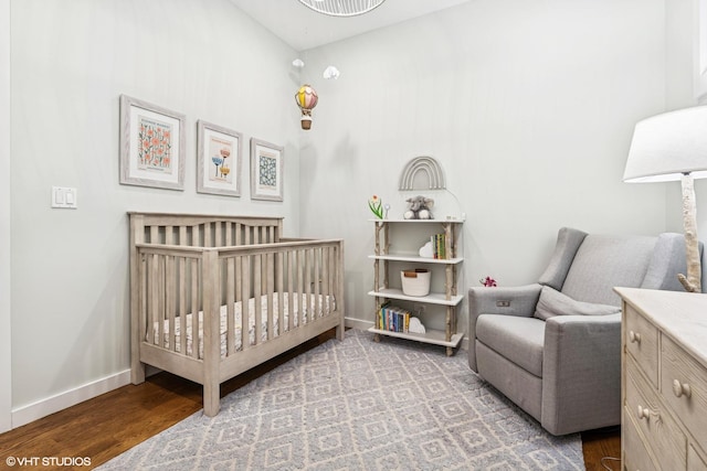 874 N Marshfield Ave Unit 1, Chicago, IL 60622 - bedroom with a crib and wood finished floors