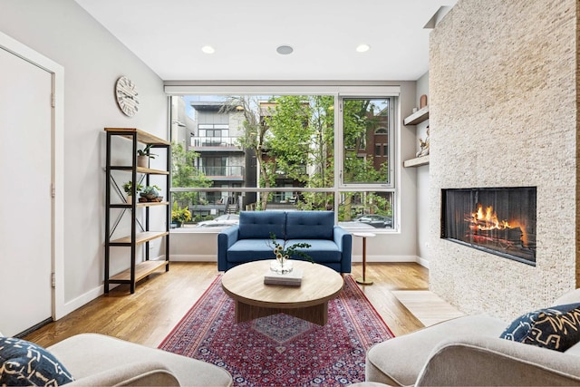 874 N Marshfield Ave Unit 1, Chicago, IL 60622 - living room with wood finished floors, a large fireplace, and recessed lighting
