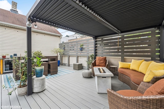 874 N Marshfield Ave Unit 1, Chicago, IL 60622 - wooden deck featuring an outdoor living space with a fire pit