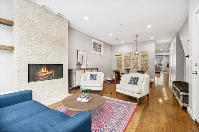 874 N Marshfield Ave Unit 1, Chicago, IL 60622 - living area with a large fireplace, wood finished floors, and recessed lighting
