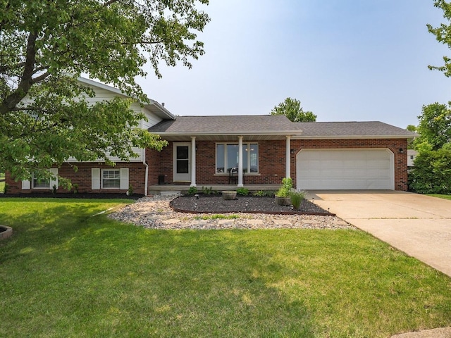 107 W 10th St, Gridley, IL 61744 - tri-level home featuring a garage, concrete driveway, a front yard, and brick siding