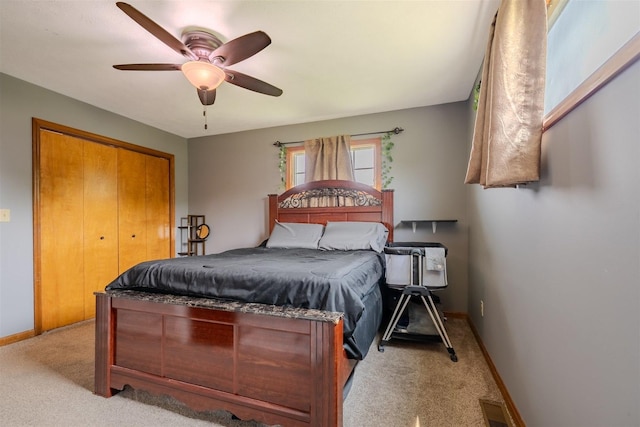 107 W 10th St, Gridley, IL 61744 - bedroom with light colored carpet, a closet, and a ceiling fan