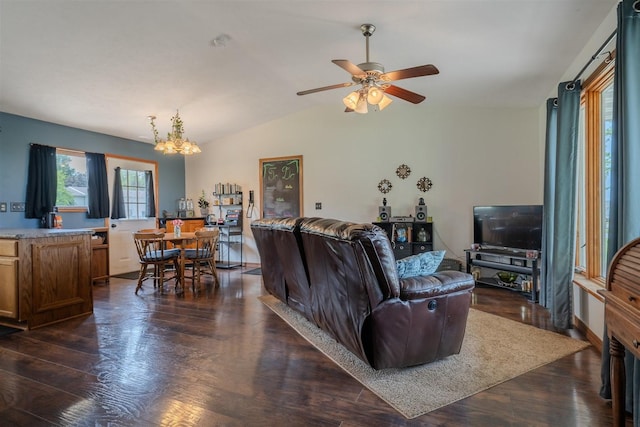 107 W 10th St, Gridley, IL 61744 - living room featuring a chandelier, dark wood-type flooring, a ceiling fan, and vaulted ceiling