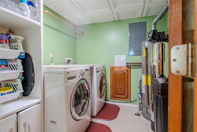 107 W 10th St, Gridley, IL 61744 - washroom featuring electric panel, washer and dryer, light tile patterned floors, and cabinet space
