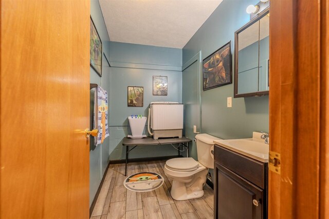 107 W 10th St, Gridley, IL 61744 - half bath featuring vanity and wood finished floors
