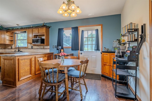 107 W 10th St, Gridley, IL 61744 - dining room featuring a chandelier and dark wood-style floors