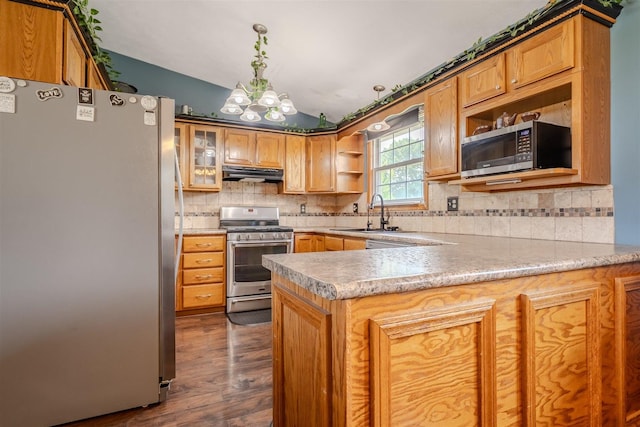 107 W 10th St, Gridley, IL 61744 - kitchen featuring appliances with stainless steel finishes, open shelves, under cabinet range hood, a peninsula, and vaulted ceiling