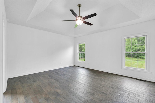 1904 Mullikin Dr, Champaign, IL 61822 - empty room with dark wood-style floors, ceiling fan, and a tray ceiling