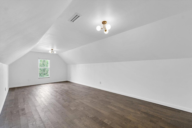 1904 Mullikin Dr, Champaign, IL 61822 - bonus room with vaulted ceiling and dark wood-style flooring