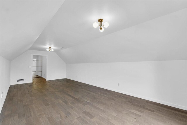 1904 Mullikin Dr, Champaign, IL 61822 - additional living space with vaulted ceiling and dark wood-type flooring