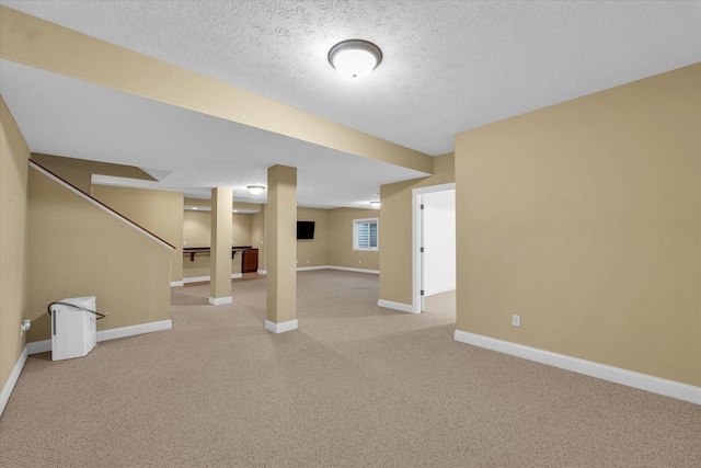 1904 Mullikin Dr, Champaign, IL 61822 - finished basement featuring light colored carpet, a textured ceiling, and stairway