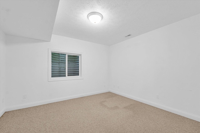 1904 Mullikin Dr, Champaign, IL 61822 - spare room with a textured ceiling and carpet flooring