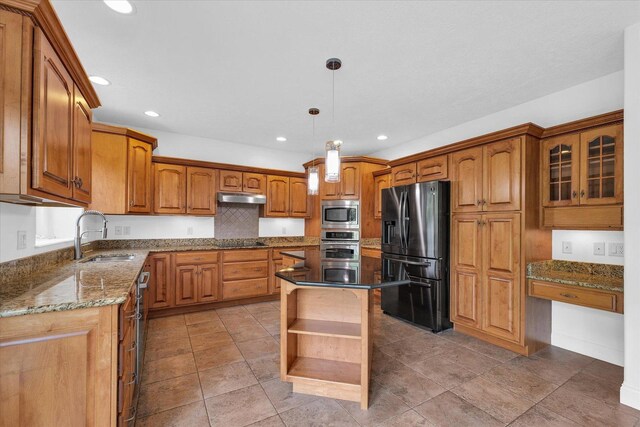1904 Mullikin Dr, Champaign, IL 61822 - kitchen featuring stainless steel appliances, open shelves, under cabinet range hood, brown cabinetry, and dark stone counters