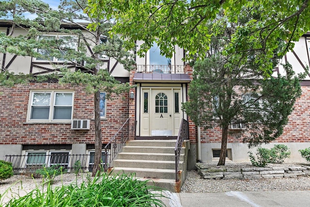 844 Village Quarter Rd Unit A5, West Dundee, IL 60118 - view of front facade featuring brick siding, entry steps, and cooling unit