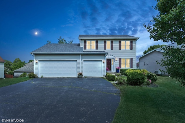 2855 Weld Rd, Elgin, IL 60124 - view of front of property featuring driveway, a garage, a front lawn, and roof with shingles