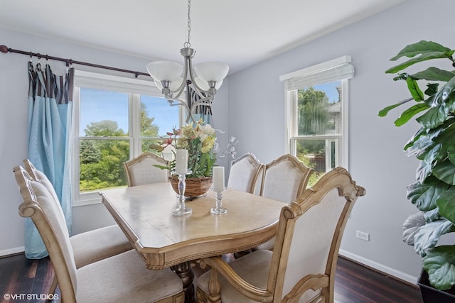 2855 Weld Rd, Elgin, IL 60124 - dining room featuring a chandelier, dark wood-style floors, and healthy amount of natural light
